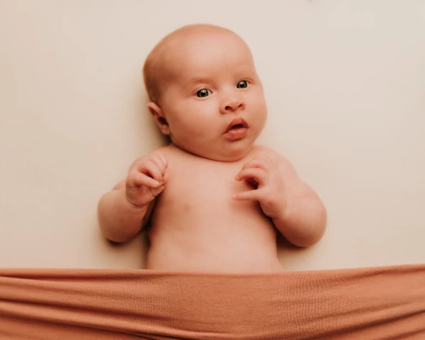 Newborn baby girl posing for her photo session