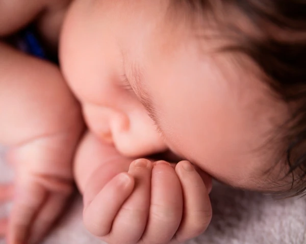 Sleepy baby face in Kamelia's studio during newborn session