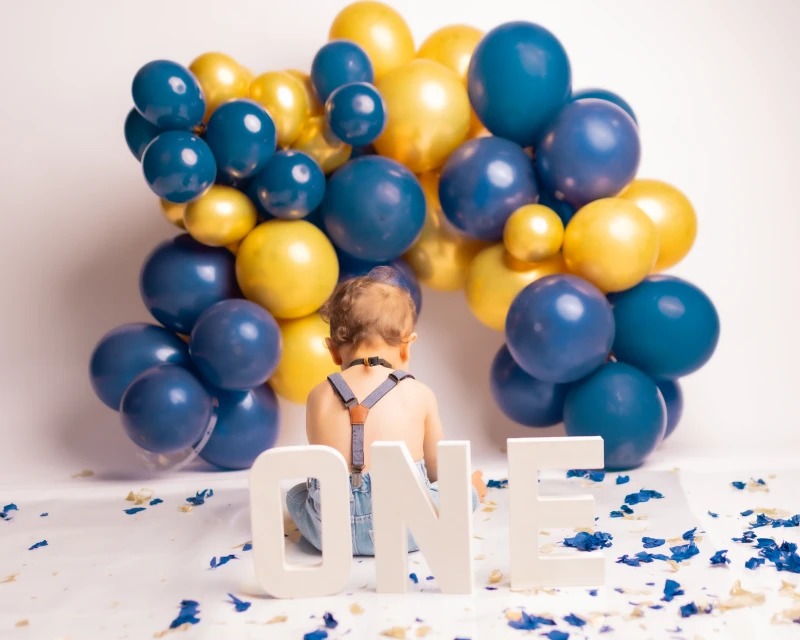 Baby boy posing for cake smash session